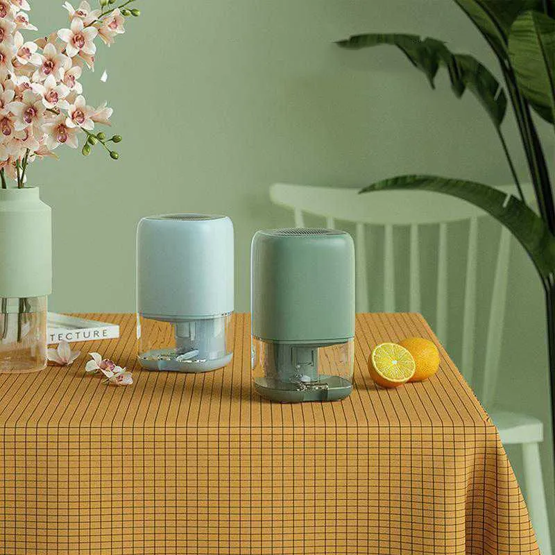 Mini Compact Air Dehumidifier Moisture Absorber with a Transparent Tank