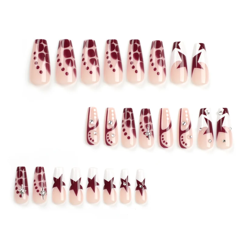 Kunstvolle Nagelverlängerungen mit Glitzer und Sternenmotiven Karnz
