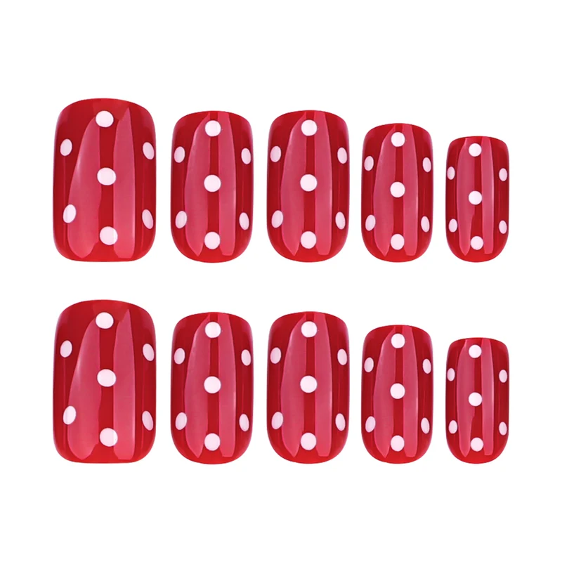 Kunstvolle Nagelkunst mit roten Punkten Karnz