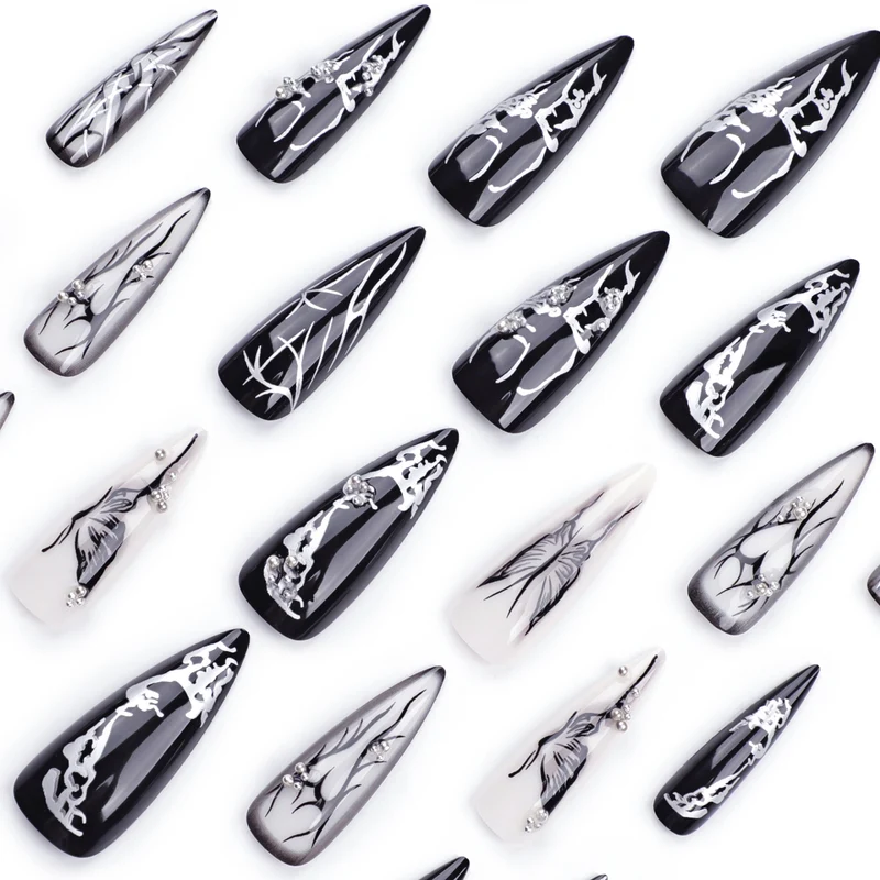 Kunstvolle Nagelkunst mit elegantem Schwarz-Weiß-Design Karnz