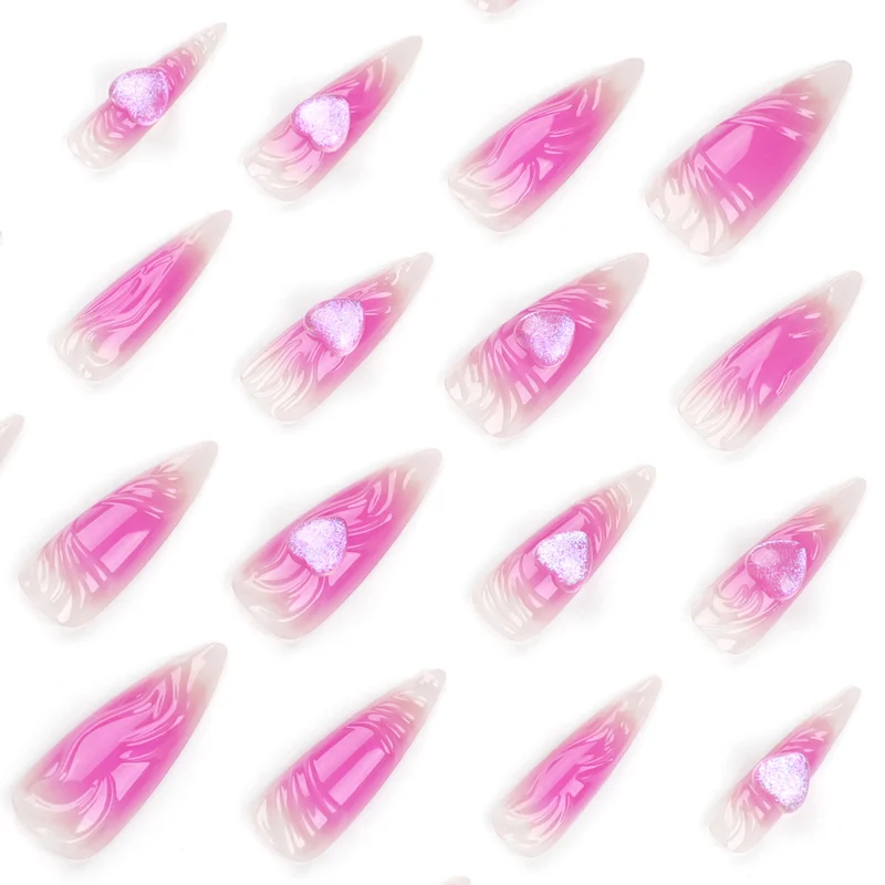 Kunstvolle Stiletto-Nägel mit Herz-Design und Glitzerakzenten Karnz