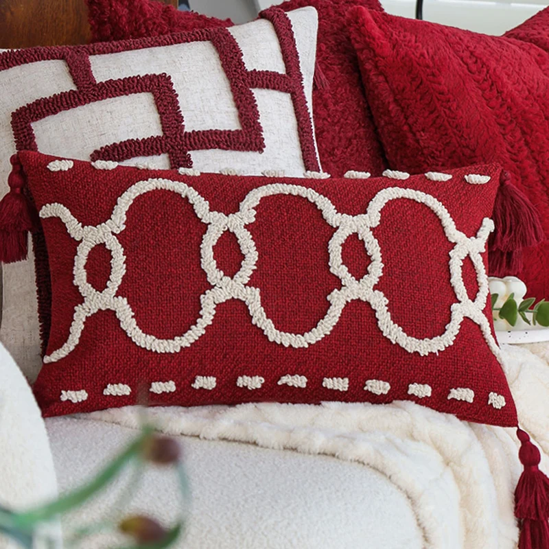 Rechteckiges Dekokissen mit Bouclé-Relief und Quasten Karnz