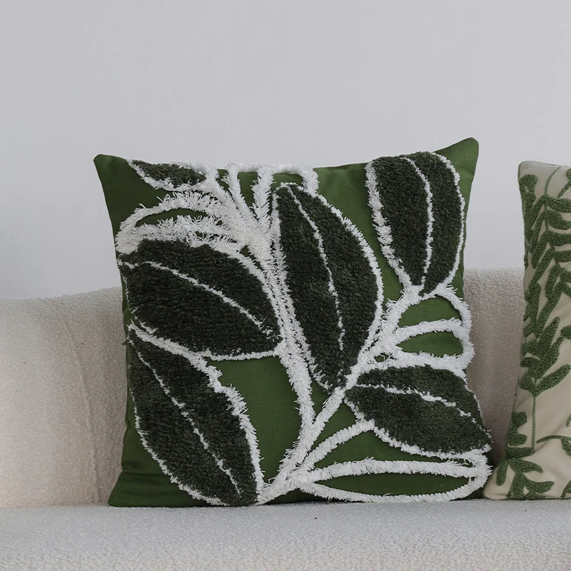 Quadratisches Zierkissen mit erhabenem Blatt‑Tufting und Quasten Karnz