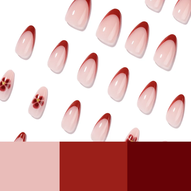 Elegante und kunstvoll gestaltete Stiletto-Nägel mit Blumendesign Karnz