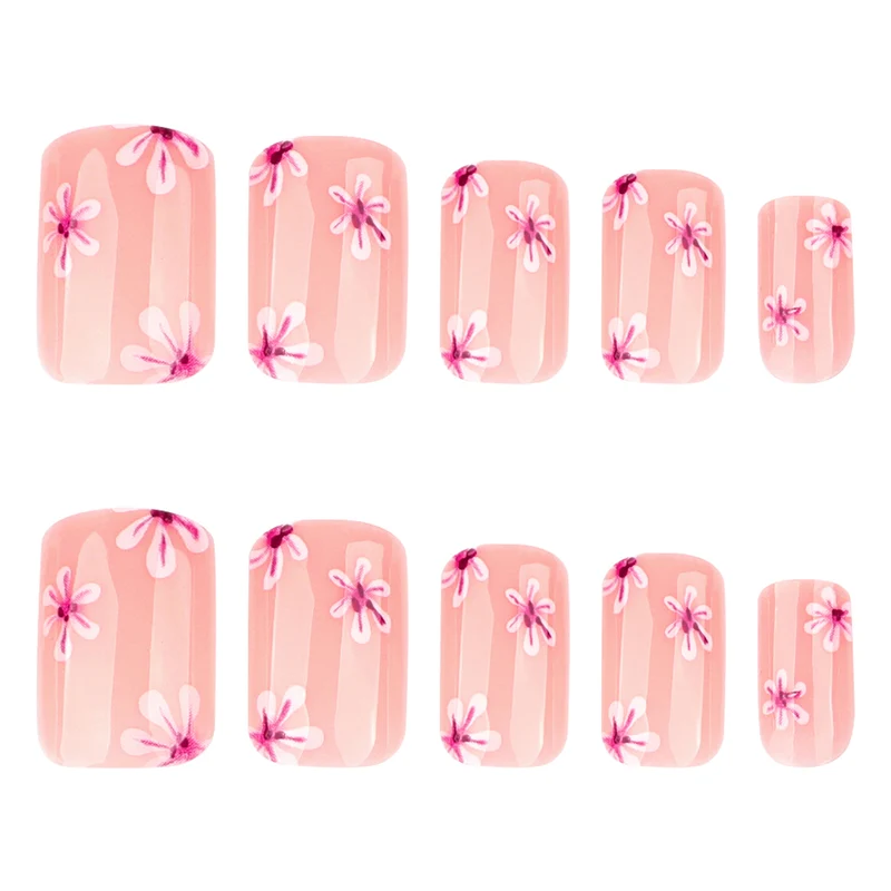 Kunstvolle Nagelkunst mit Blumen-Design und Blauem French Tip Karnz