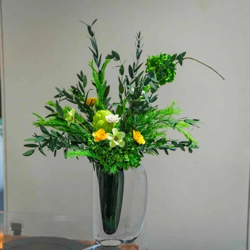 Künstliche grüne Blumenmittelschmuck
