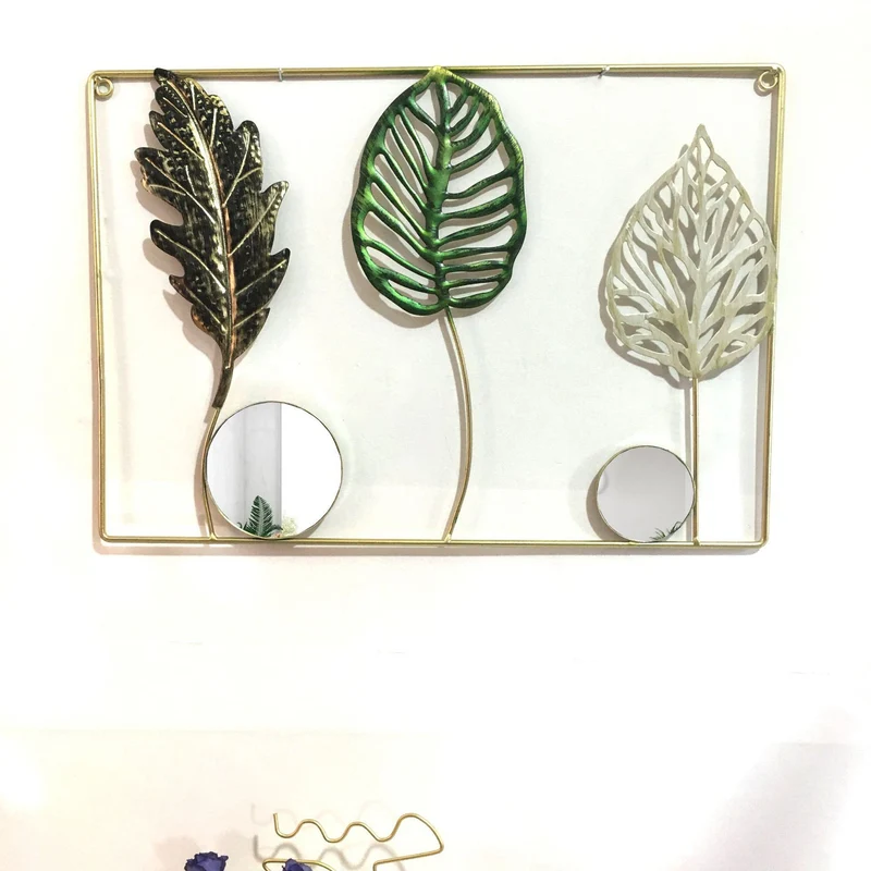 Dekorative Metallwandkunst mit tropischem Blatt- und Spiegeldesign Karnz