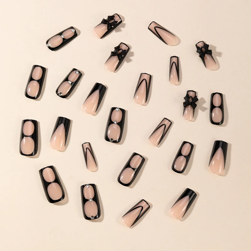 Elegante Stiletto-Nagelkunstverlängerungen mit Schleifenakzenten Karnz