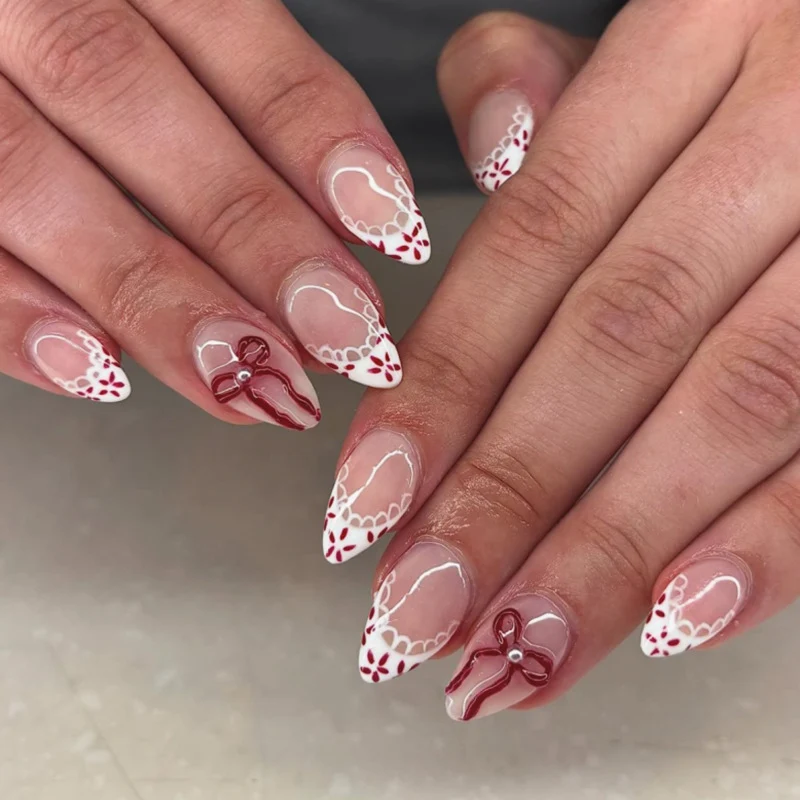 Kunstvolle Acryl-Nägel mit eleganten floralen Akzenten Karnz