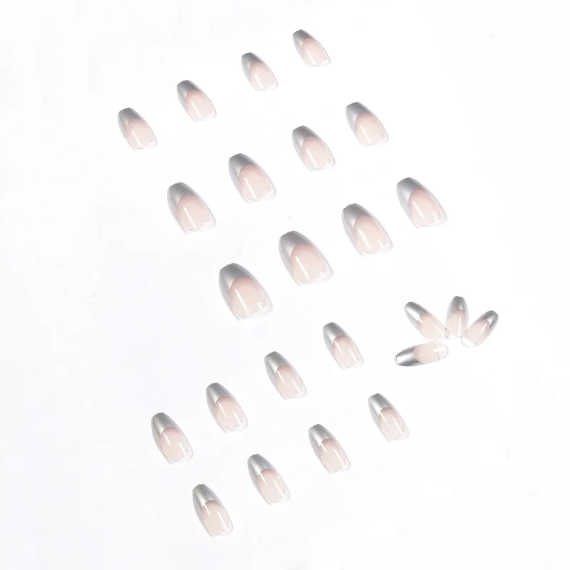 Künstliche Stiletto-Nägel mit Glitzerakzenten und elegantem French-Tip Karnz