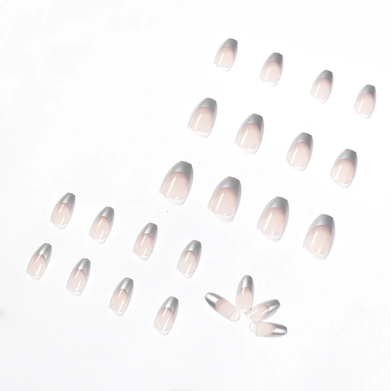 Künstliche Stiletto-Nägel mit Glitzerakzenten und elegantem French-Tip Karnz