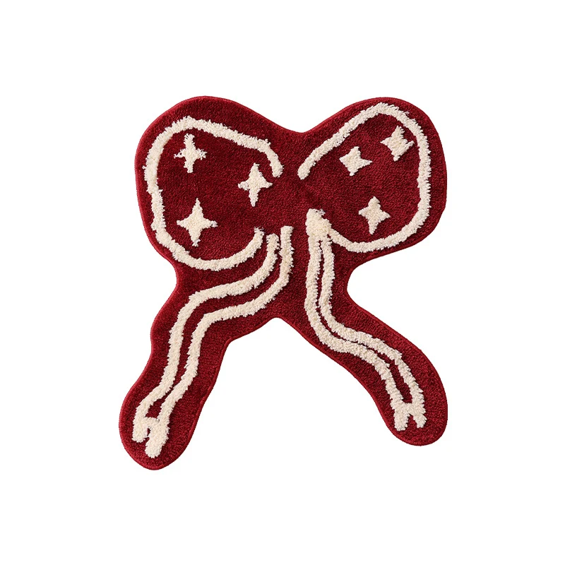 Geformter getufteter Zierteppich mit Schleifen- und Sternmotiv Karnz