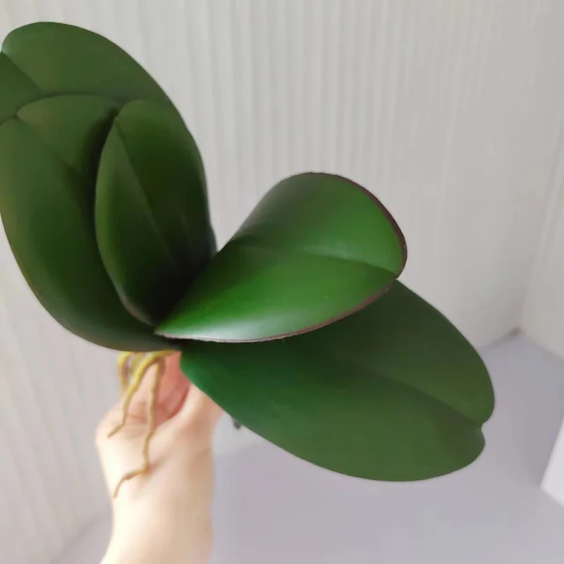 Realistische Orchideenblatt-Anordnung