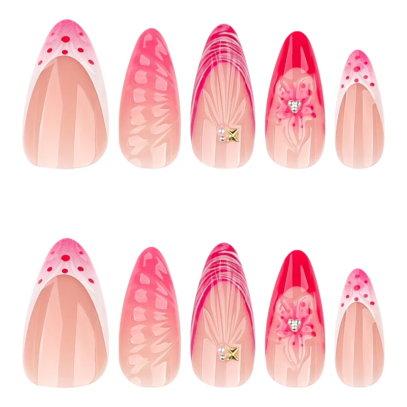 Kunstvolle Stiletto-Nägel mit floralem Design und Glitzerakzenten Karnz