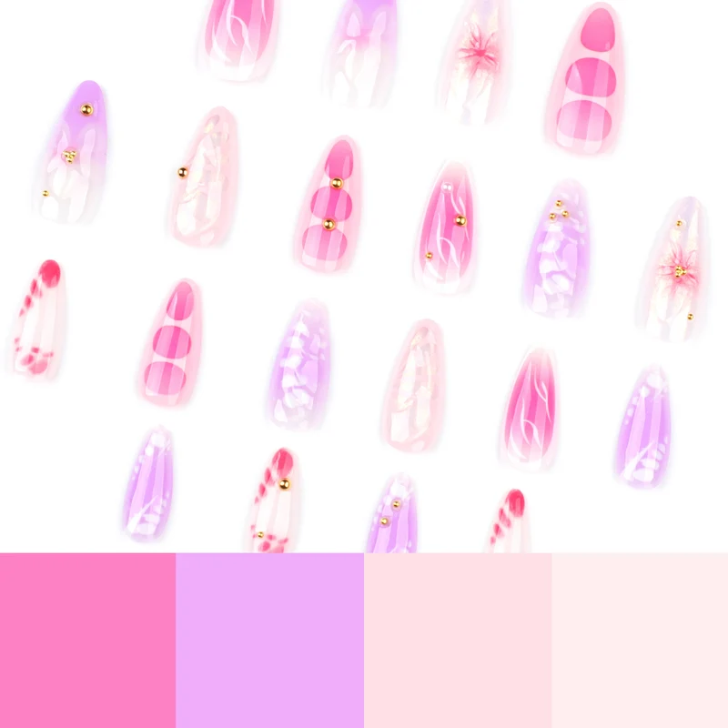 Kunstvolle Nagelverlängerungen mit floralen Mustern und Strassverzierungen Karnz